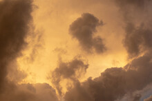 Heavy Cloud Cover During An Orange Sunset