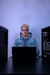 caucasian man working with programming in dark background. hacker, engineer, program developer conce