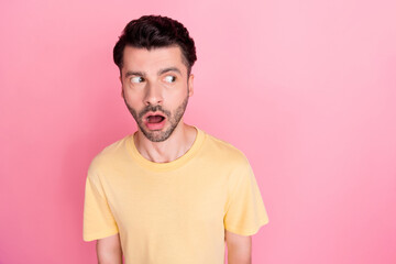 Sticker - Portrait of interested curious man with stylish haircut wear yellow t-shirt staring at empty space isolated on pink color background