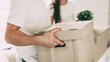 © yurolaitsalbert - close up. large cardboard box in the hands of a young man.