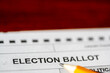 Selective focus on a generic election ballot with a pencil on top.