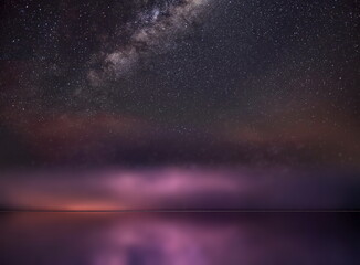 Wall Mural - night starry sky and moon at sea lilac blue nebula cosmic milky way aurora seascape