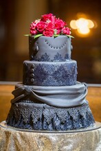 Black Large Wedding Cake With Red Roses On The Top
