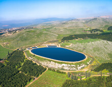 Aerial View Of Reservoir In A Shape Of A Big Foot. Amiad, Northern District, Israel.