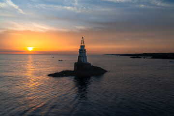 Poster - view of the small harbor lighthosue in Athopol on the Black Sea coast of Bulgaria at sunrise