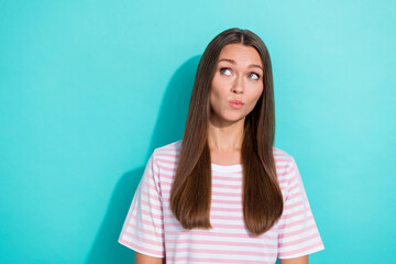 Wall Mural - Photo of thoughtful minded girl with long hairstyle wear striped t-shirt dreaming look empty space isolated on turquoise color background