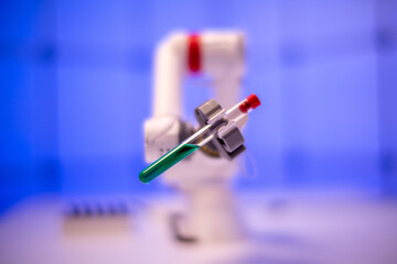 Canvas Print - Robot take a test tube with a liquid. Laboratory of poisonous and hazardous chemicals