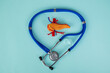 pancreas and stethoscope lies on a blue background