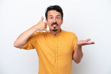 Wall Mural - Young man with moustache isolated on white background making phone gesture and doubting