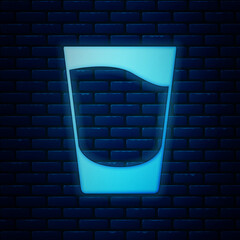 Poster - Glowing neon Shot glass icon isolated on brick wall background. Vector