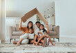 Family, care and home insurance roof portrait with parents protecting house and children. Cardboard, covering and safety with parents keeping with kids safe. Love, mortgage and family house cover