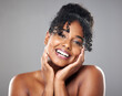 © Kirsten Davis/peopleimages.com - Beauty, black and woman with natural curly hair and glowing skin isolated on studio background. African american model, smooth skin and happy for cosmetic, face and skin health. and wellness.