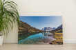 © Angelov - Canvas photo print on wooden floor. Sample of gallery wrapping method of canvas stretching on stretcher bar. Corner and edge of colorful photography closeup
