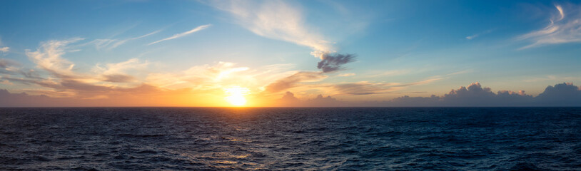 Wall Mural - Dramatic Colorful Sunset Sky over North Atlantic Ocean. Cloudscape Nature Background. Panorama