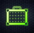Glowing neon Guitar amplifier icon isolated on brick wall background. Musical instrument. Vector