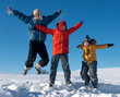 © Chepko Danil - three boy family friends joyfully jump into the sky over snow drifts in the winter, children play