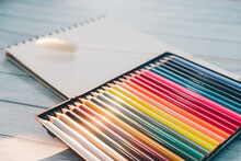 Colorful Wooden Pencils And Hay Flowers On Blank Sketchbooks And  Emotionally And Mentally Relaxed Pastime, Soft Tone And Warm By The Sunlight By The Window, Hobby And Relaxation Concept.