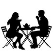 man and woman meeting sat at a table with tea, drinks