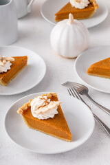 Wall Mural - Slices of traditional pumpkin pie in a light and bright setting