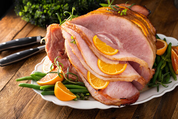 Wall Mural - Christmas honey glazed ham spiral sliced stuffed with orange slices