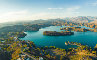 Green Canyon nature reserve in Turkey. Drone view of the magnificent Green lake Manavgat surrounded by mountain cliffs, flat landscape with buildings and roads. High quality photo