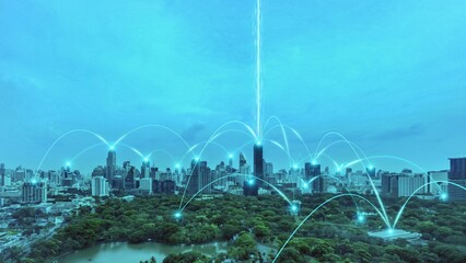 Smart digital city with connection network reciprocity over the cityscape . Concept of future smart wireless digital city and social media networking systems that connects people within the city .