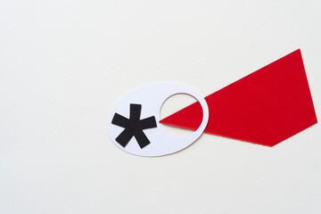 Poster - asterisk on white paper shape with hole and red triangle