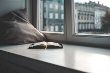 Open Bible On Windowsill, City View, Morning Prayer