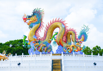 Wall Mural - Golden dancing dragon at Suan Sawan, Sawan Park or Paradise Park in Nakhon Sawan Province, Thailand.