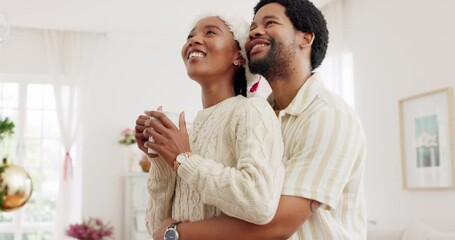 Canvas Print - Christmas, hug and couple with coffee, tree and love in the living room of a house together. Happy, smile and African man and woman with tea to relax while dancing during a festive celebration