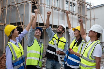 Wall Mural - Engineers on building site. Engineer are working contruction on site plans to build high-rise buildings building. Architect caucasian man working with colleagues mixed race in the construction site.