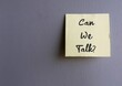Yellow stick note on gray wall written CAN WE TALK? - concept of boss , manager, partners or friends approach to have a serious talk or difficult conversation to solve conflicts or relationship issues
