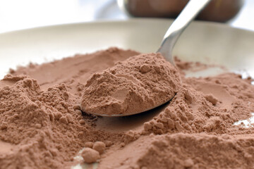 Chocolate powder on a spoon. 