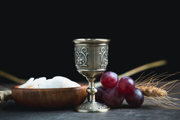 Concept of Eucharist or holy communion of Christianity. Eucharist is sacrament instituted by Jesus. during last supper with disciples. Bread and wine is body and blood of Jesus Christ of Christians.