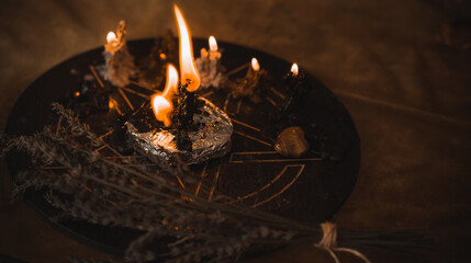 Witch altar. Concept of fortune telling and predictions of fate, candle magic and wicca elements on a table