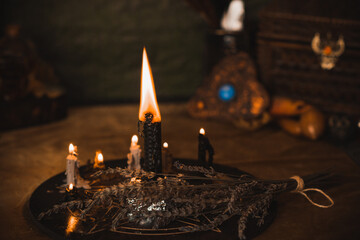 Witch altar. Concept of fortune telling and predictions of fate, candle magic and wicca elements on a table