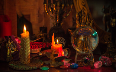 Witch altar. Concept of fortune telling and predictions of fate, candle magic and wicca elements on a table