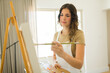 © AntonioDiaz - Happy female artist creating a beautiful painting