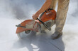 © ungvar - Diamond blade saws are used by construction workers to cut concrete sidewalk