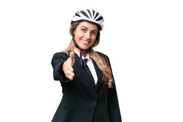 Canvas Print - Business Uruguayan woman wearing a helmet biker over isolated background shaking hands for closing a good deal