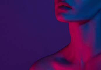 Woman on pink blue neon background.