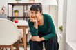 © Krakenimages.com - Young beautiful hispanic woman smiling confident sitting on chair at home