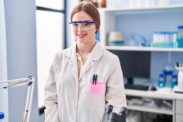 Poster - Young blonde woman wearing scientist uniform standing at laboratory