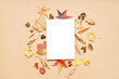 © Pixel-Shot - Composition with blank card and autumn leaves on color background