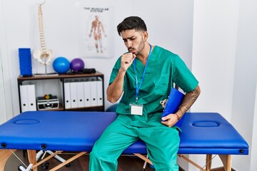 Canvas Print - Young physiotherapist man working at pain recovery clinic feeling unwell and coughing as symptom for cold or bronchitis. health care concept.