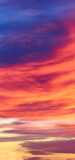 Fototapeta Zachód słońca - Sunset with sun and clouds on blue and orange dramatic sky.