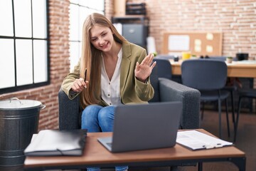 Wall Mural - Young caucasian woman business worker having video call at office