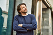 © Krakenimages.com - Middle age handsome man smiling with crossed arms at the town
