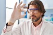 © Krakenimages.com - Middle age man scientist holding pill at laboratory