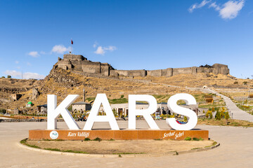 Wall Mural - Kars Castle and city logo view in Kars City of Turkey